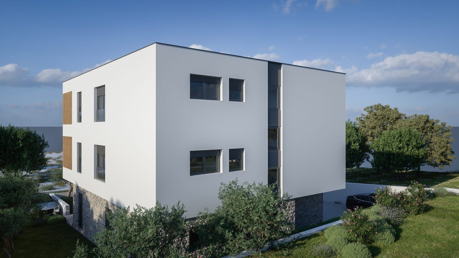 Moderní rodinný dům s bílou fasádou a kamennými prvky v klidné lokalitě, obklopený zelení a stromy, s minimalistickým designem a velkými okny.