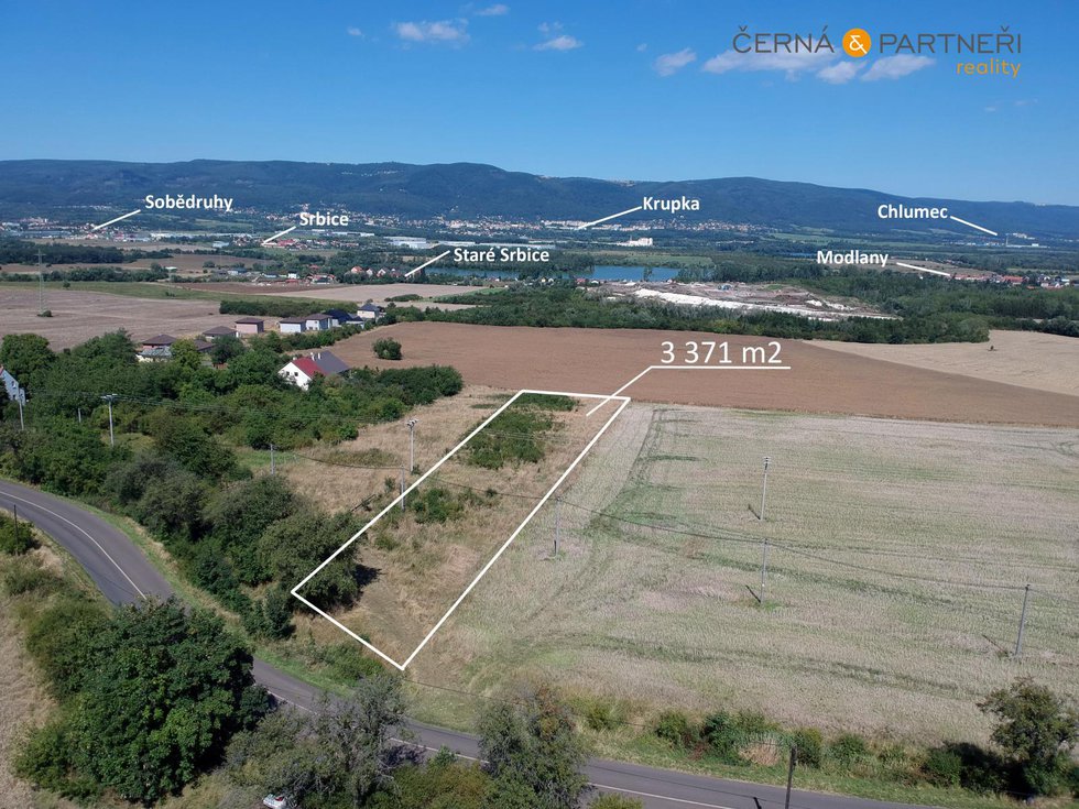 Prodej stavební parcely 3371 m², Modlany